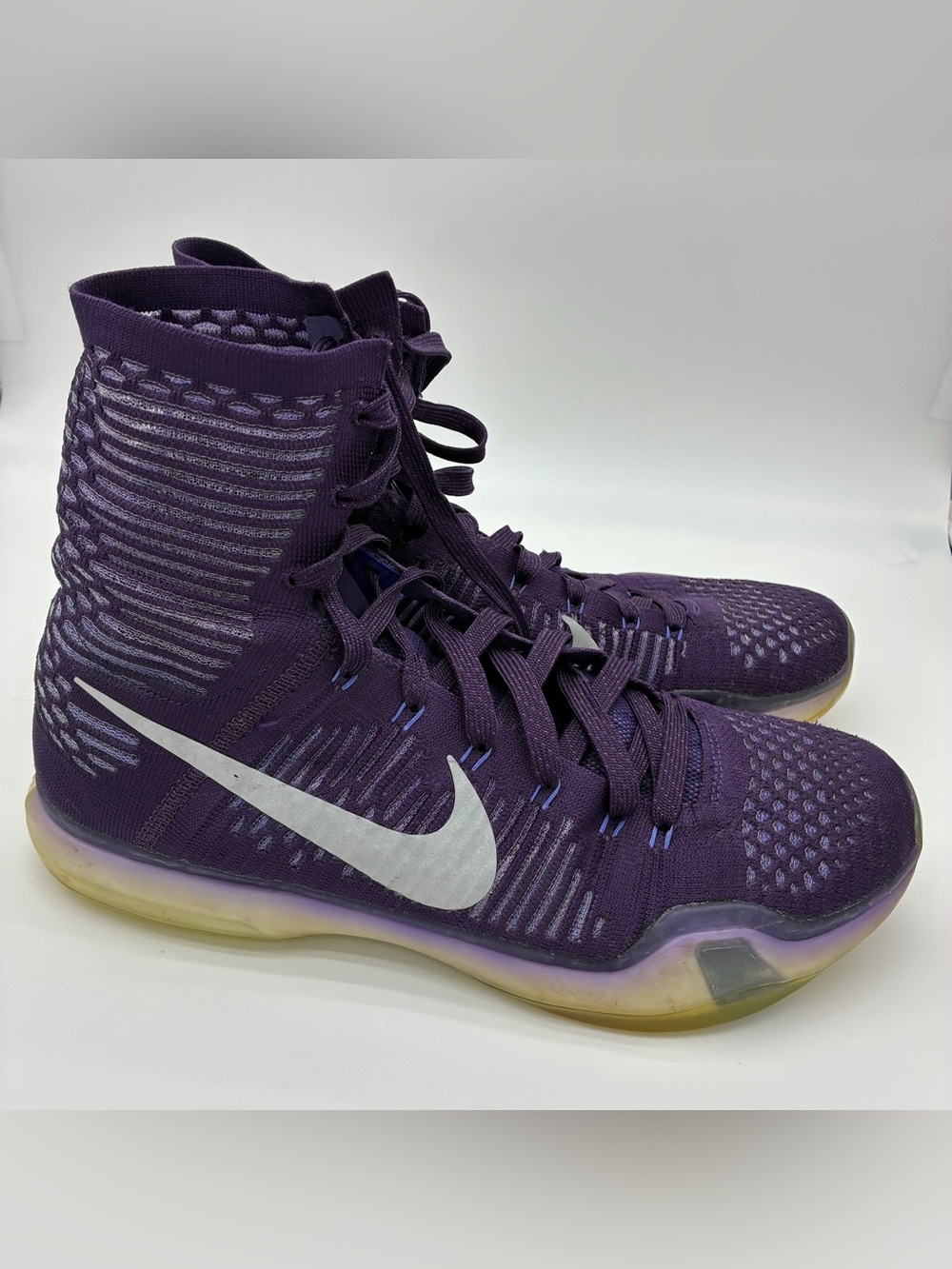 Nike Women’s Purple High-Top Sneakers with White Swoosh